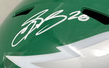 A Saquon Barkley signed Eagles FS Kelly Green Replica Speed Helmet by Sports Integrity, featuring his autograph with "#26" and a partial white lightning bolt design. Authenticated by PSA/DNA.
