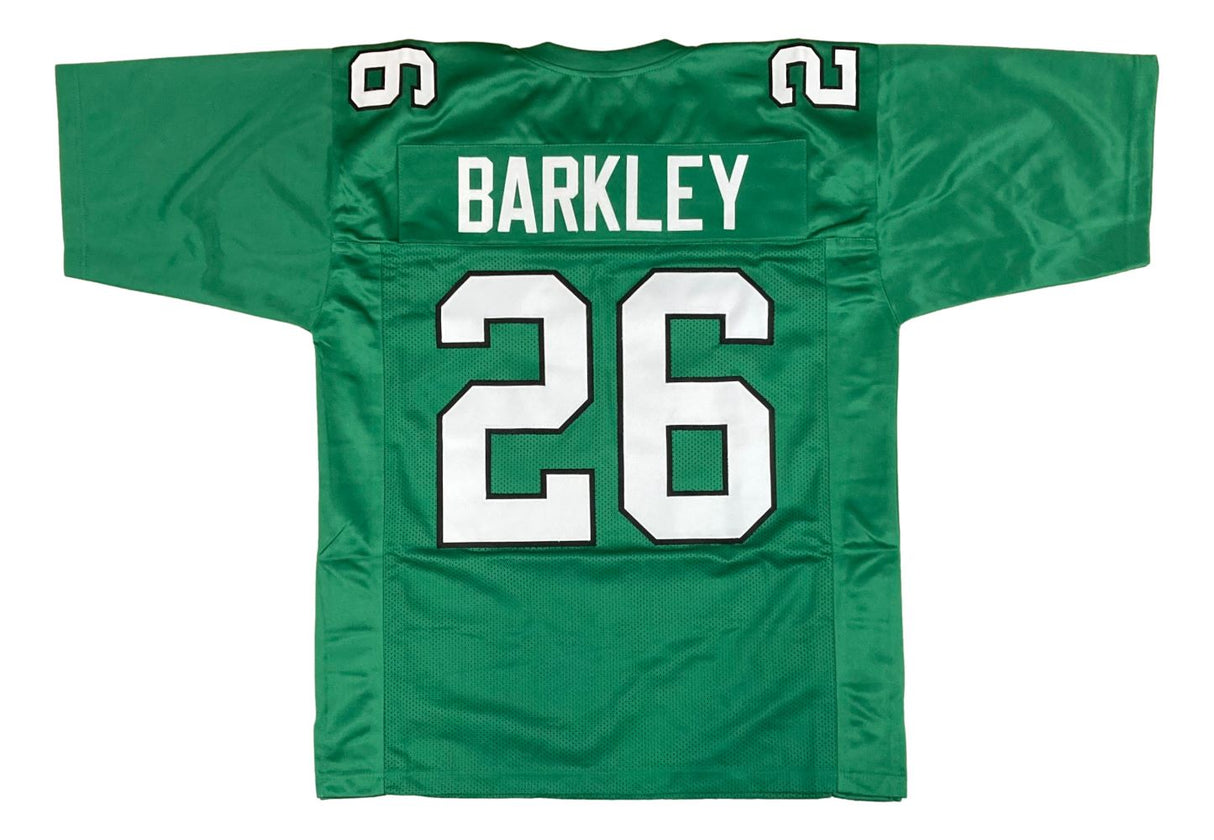 The Sports Integrity Saquon Barkley Philadelphia Kelly Green Football Jersey features "BARKLEY" and the number 26 in white and black on the back, with 26 also displayed on both shoulders.