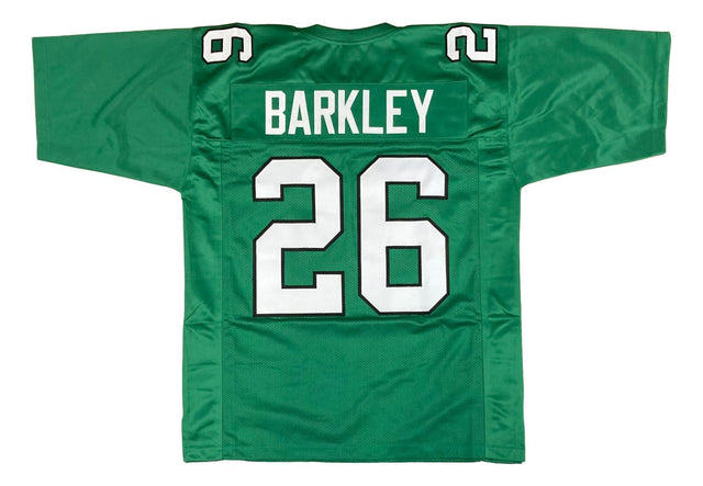 The Sports Integrity Saquon Barkley Philadelphia Kelly Green Football Jersey features "BARKLEY" and the number 26 in white and black on the back, with 26 also displayed on both shoulders.