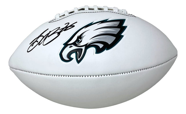 A Saquon Barkley signed Philadelphia Eagles logo football by Sports Integrity, authenticated by PSA/DNA, featuring a black signature on the white surface.