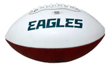 A white and brown Sports Integrity football, signed by Saquon Barkley, features the green EAGLES logo, white laces, and a PSA/DNA authentication sticker near the top.