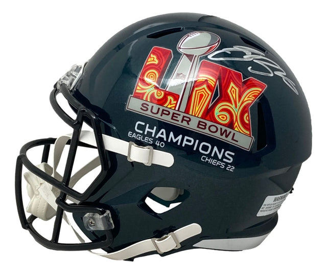 The Sports Integrity Saquon Barkley Signed Eagles Super Bowl 59 LIX FS Replica Speed Helmet features a black facemask, white chin strap, and a champion logo with score, authenticated by PSA/DNA.