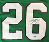 The Sports Integrity Saquon Barkley Signed Eagles Kelly Green Nike Game Replica Jersey features #26 in white with black outline, an autograph on the right digit in black ink, and a PSA/DNA authentication sticker below.
