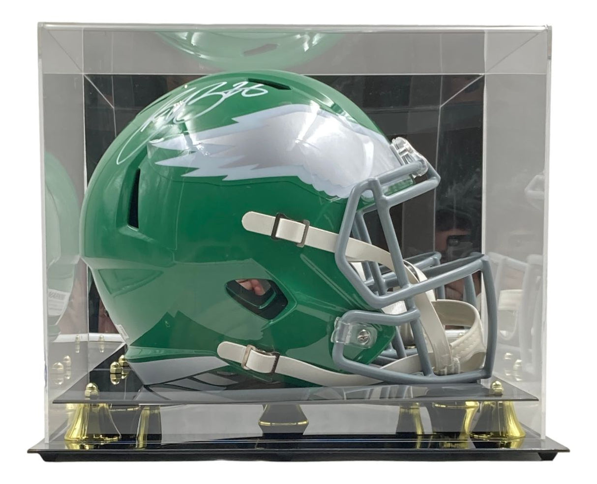The Sports Integrity Saquon Barkley signed Eagles FS Kelly Green Replica Speed Helmet features a white wing design, Kelly green color, white marker signature on top, and comes in a clear display case with black base and gold accents.