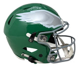 The Saquon Barkley Signed Eagles FS Kelly Green Authentic SpeedFlex Helmet by Sports Integrity features a silver wing design and gray facemask, representing the Philadelphia Eagles.