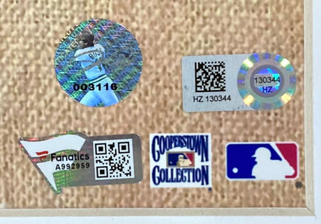 Five authentication and branding stickers on a textured background, including Fanatics, Cooperstown Collection, MLB logos, and two holographic QR code stickers with serial numbers for the Sports Integrity Mike Schmidt Pete Rose Steve Carlton Signed Framed 16x20 Phillies Photo.