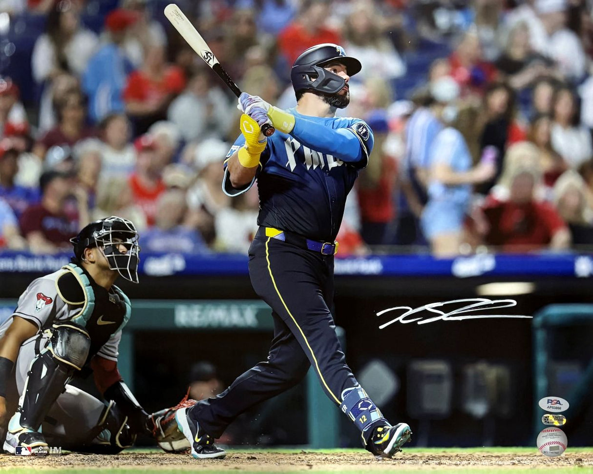 Philadelphia Phillies' Kyle Schwarber swings the bat in this signed 16x20 City Connect photo by Sports Integrity, authenticated by PSA/DNA, with a stadium crowd blurred in the background.
