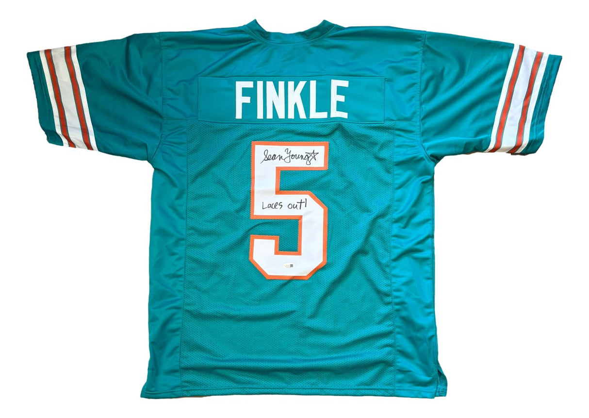 The Sports Integrity Sean Young Ace Ventura Signed Finkle Jersey features teal fabric with FINKLE and number 5, white and orange trim, and "Laces out!" inscribed along with Sean Young's autograph. Authenticated by JSA QR.