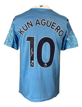 The Sports Integrity Sergio Aguero Signed Manchester City Puma Soccer Jersey BAS is light blue with "KUN AGÜERO" and number 10 on the back in dark letters, white sleeve patterns, and a small Premier League logo below the number.