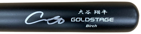 A close-up of a Shohei Ohtani Los Angeles Dodgers Signed Asics Game Model Bat by Sports Integrity, featuring “GOLDSTAGE Birch,” a white signature, and Japanese characters above the brand name.