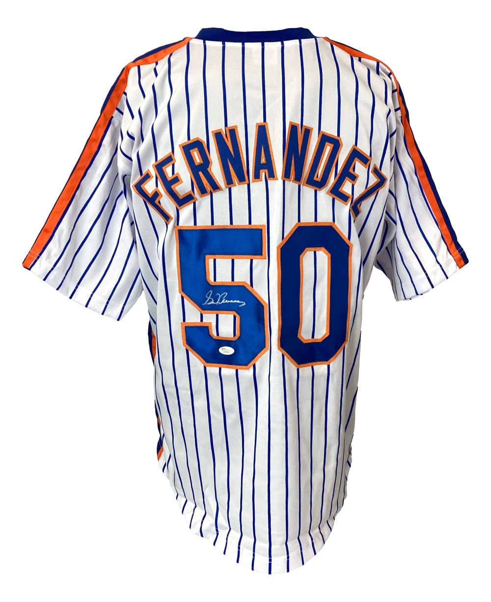 The Sports Integrity Sid Fernandez New York Signed White Baseball Jersey JSA features blue pinstripes, orange accents, and "Fernandez" above a signed #50 in blue and orange, displayed from the back.