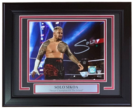 The Sports Integrity Solo Sikoa Signed Framed 8x10 WWE Photo by Fanatics shows the wrestler in a ring, red and black shorts, arm bandaged. The plaque reads: SOLO SIKOA Street Champion Of The Island.