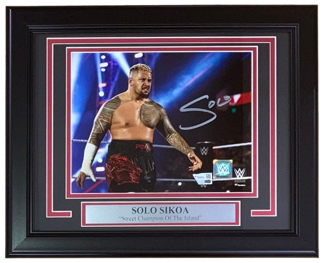 The Sports Integrity Solo Sikoa Signed Framed 8x10 WWE Photo by Fanatics shows the wrestler in a ring, red and black shorts, arm bandaged. The plaque reads: SOLO SIKOA Street Champion Of The Island.