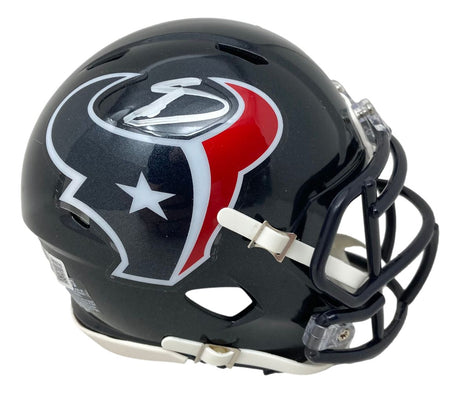 The Stefon Diggs Signed Houston Texans Mini Speed Helmet by Sports Integrity features a black shell with a white, red, and silver bull logo and star, black facemask, and white chin strap.