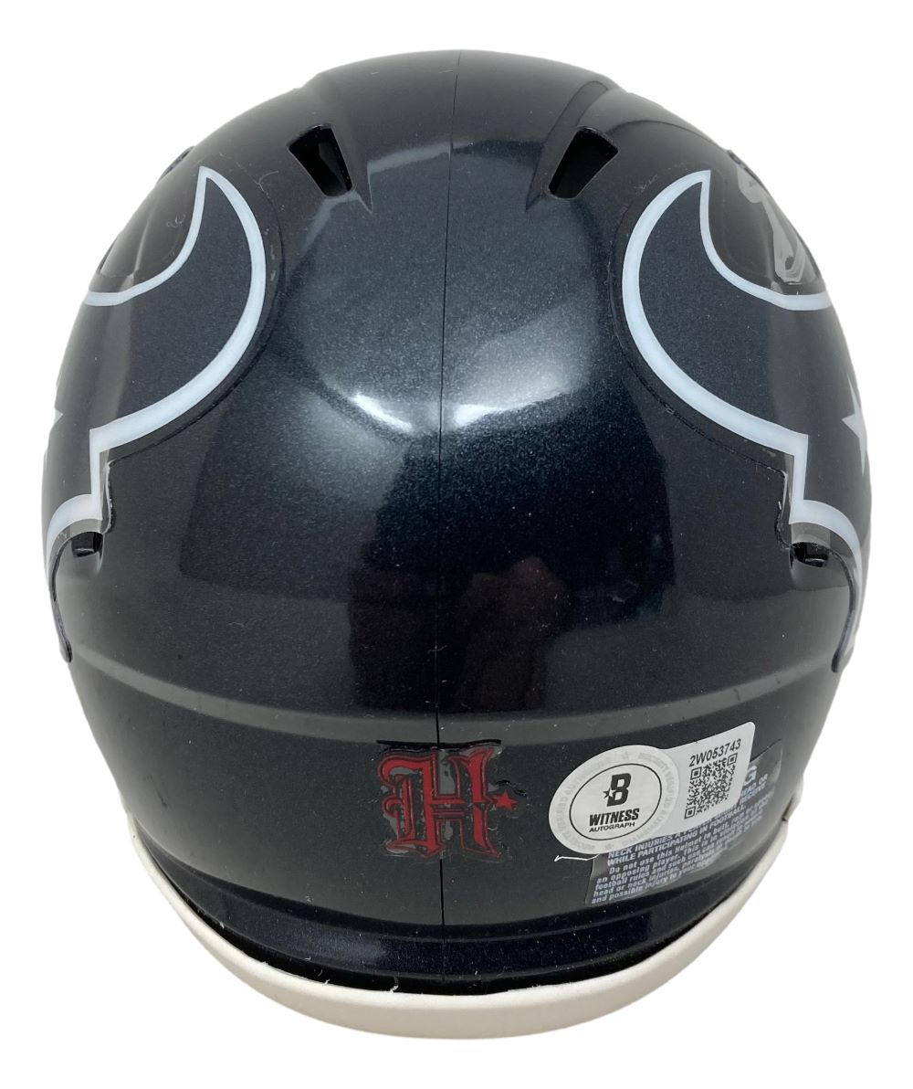 A Stefon Diggs Signed Houston Texans Mini Speed Helmet by Sports Integrity is shown from the back, featuring a white and gray bull horn design, a red H logo, and a white sticker with text and QR code near the bottom.