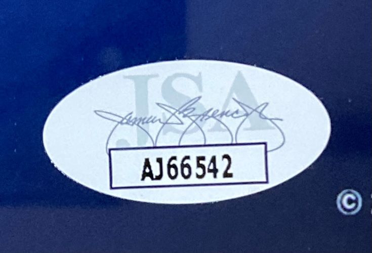 A Stephen Curry Signed Framed 16x20 Golden State Warriors Scoring Leader Photo by Sports Integrity features a JSA oval sticker with signatures and code AJ66542 on a dark blue surface.