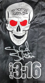 Stone Cold Steve Austin Signed Autographed WWE Skull Vest by Sports Integrity, featuring a skull with red eyes and "STONE COLD" on its forehead, signed in white marker and "AUSTIN 3:16" embroidered below.