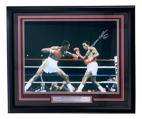 Sports Integrity Sugar Ray Leonard Signed Framed 16x20 Boxing Swing Photo BAS ITP features an autographed action shot of Leonard in the ring, with a metal plaque displaying his name.