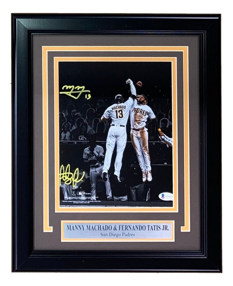 Sports Integrity Fernando Tatis Jr. and Manny Machado Signed Framed 8x10 San Diego Padres Photo features both stars celebrating mid-game, includes their autographs and a name plaque—perfect for any fan collection.