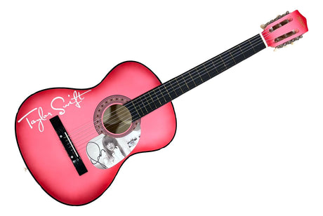 The Sports Integrity Taylor Swift Signed 38" Tortured Poets Department Pink Acoustic Guitar 2 PSA Holo features a large white Taylor Swift signature on the body and her photo with autograph by the sound hole.