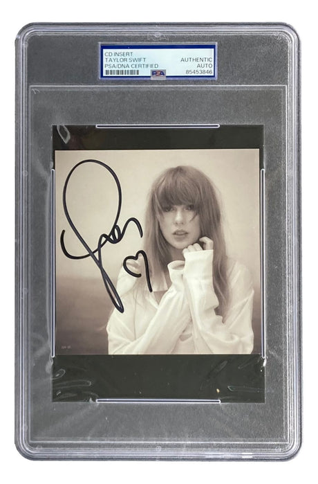A Taylor Swift Signed RARE HEART Tortured Poets Department CD Insert by Sports Integrity, sepia-toned with PSA authentication holder and certification number.