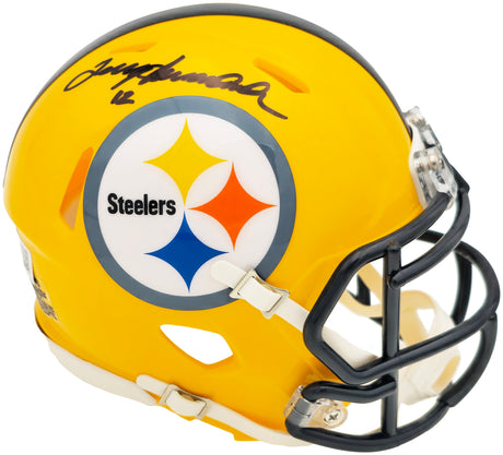 The Sports Integrity Terry Bradshaw Signed Pittsburgh Steelers Yellow Mini Speed Helmet features a black facemask, team logo, and Bradshaw's autograph in black ink on top.