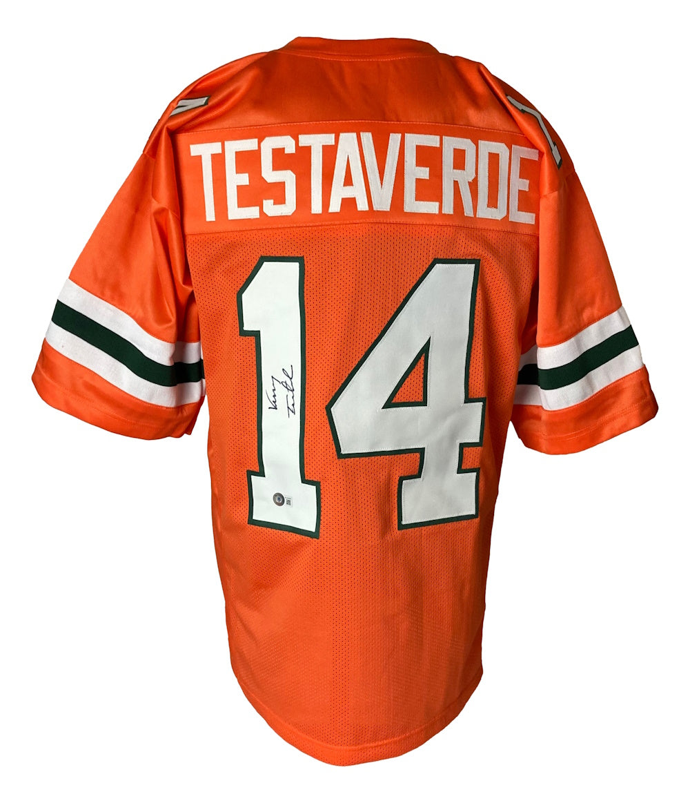 The Sports Integrity Vinny Testaverde Miami Signed College Football Jersey BAS ITP is an orange jersey with green and white sleeve stripes, featuring TESTAVERDE and a signed number 14 on the back.