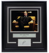 Sports Integrity's Al Pacino Framed 8x10 The Godfather Chair Photo features Michael Corleone seated, with a plaque and a laser-engraved signature displayed below.
