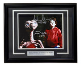 The Sports Integrity Henry Thomas & Matthew De Merritt Signed Framed 11x14 E.T. Photo features autographs and a nameplate, authenticated by JSA.