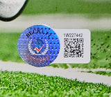 A Tommy Devito Signed 8x10 New York Giants Photo by Sports Integrity, featuring BAS ITP authentication sticker 1W227442, is shown on a grassy surface.