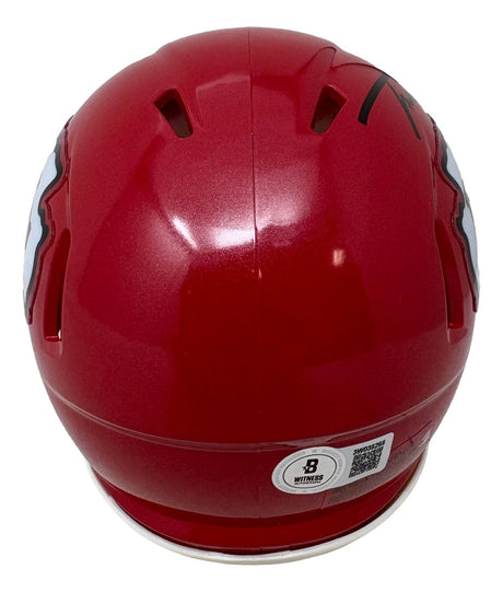 The Sports Integrity Trent McDuffie Signed Kansas City Chiefs Mini Speed Helmet BAS is a red helmet shown from the back, with ventilation holes, team decals on the sides, and a Beckett Witness QR code sticker near the bottom.