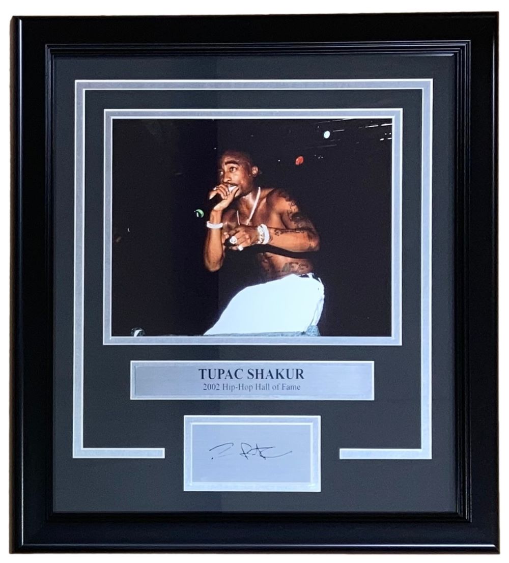 The Sports Integrity Tupac Shakur Framed 8x10 Concert Photo features a laser engraved signature and a plaque, beautifully displayed on a black and silver mat.