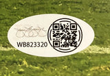 An oval sticker on grass displays a black QR code, serial number WB823320, and an overlapping signature with 0000 loops on the left side for the Tyler Warren Signed 8x10 Penn State Nittany Lions vs USC Photo by Sports Integrity.