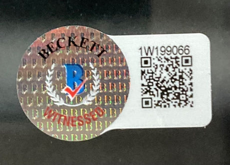 A holographic Beckett ‘Witnessed’ sticker is displayed beside a white QR code label with alphanumeric code 1W199066 on the Tyreek Hill Signed Framed 16x20 Miami Dolphins Photo BAS by Sports Integrity.