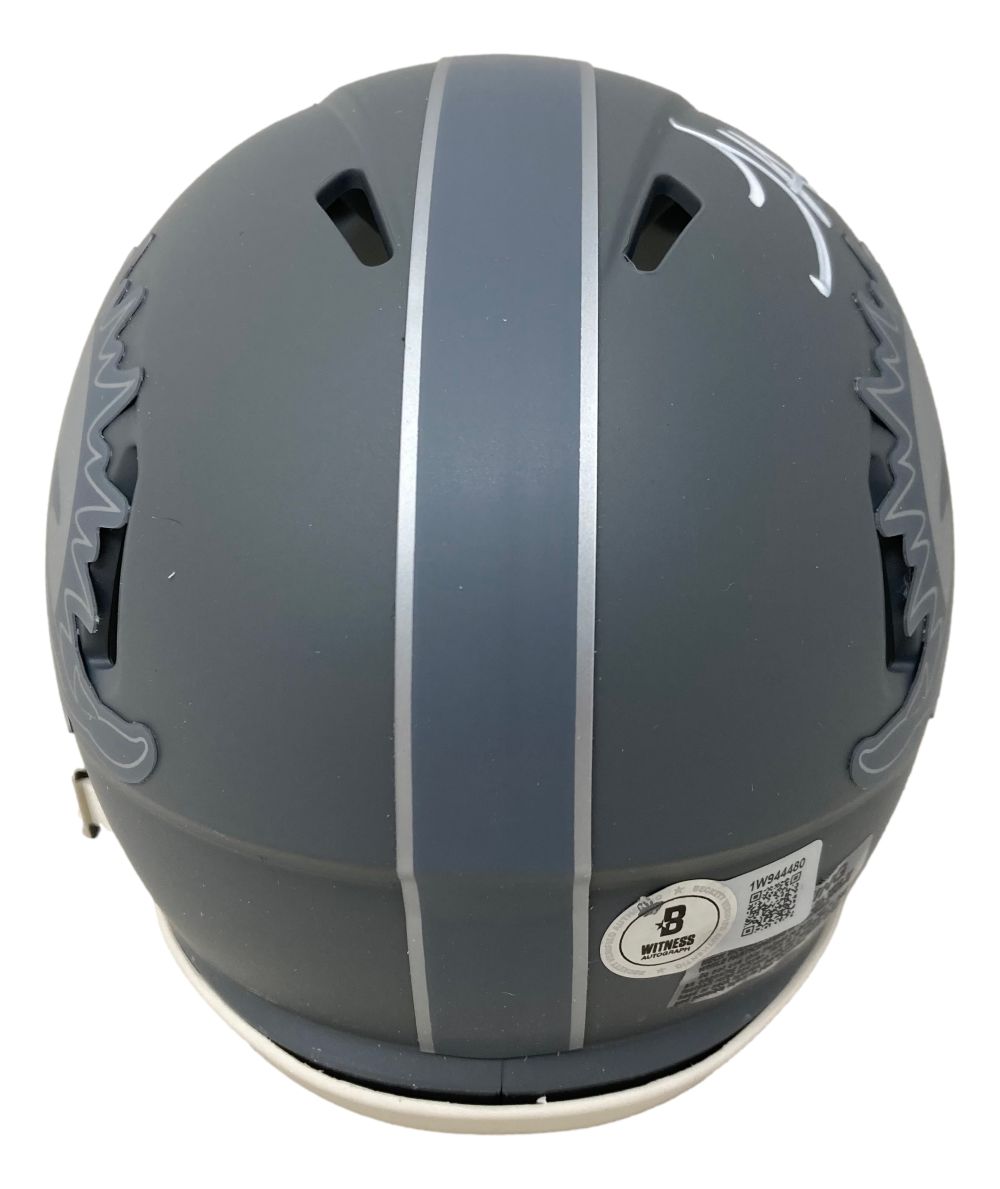 The Tyreek Hill Signed Miami Dolphins Slate Mini Speed Helmet by Sports Integrity features a gray finish, white vertical stripe, vent openings, wavy side graphics, and a safety certification sticker at the back.