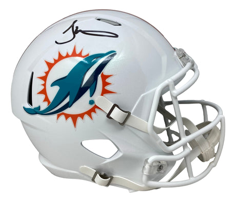 The Tyreek Hill Signed Miami Dolphins Full Size Speed Replica Helmet by Sports Integrity features a white helmet with the team’s teal dolphin and sun logo, a white faceguard, and Tyreek Hill's black marker signature on top.