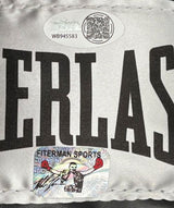 A Mike Tyson signed black Everlast right-hand boxing glove by Sports Integrity features JSA QR and holographic authentication stickers, with a case included. The glove displays bold white "ERLAS" lettering.