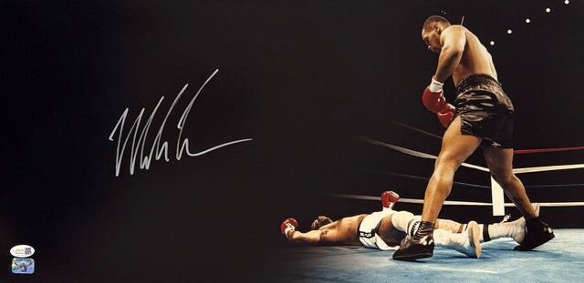 A dramatic Mike Tyson stands over his fallen opponent in this 12x24 panoramic boxing photo, signed and authenticated with a JSA QR hologram. Offered by Sports Integrity.