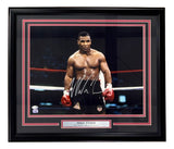 This Sports Integrity framed 16x20 photo features Mike Tyson shirtless in the ring with red gloves, hand-signed and authenticated by a JSA QR hologram. Plaque reads: Mike Tyson "The Baddest Man on the Planet.
