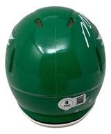 The Sports Integrity Michael Vick Signed Philadelphia Eagles Kelly Green Mini Speed Helmet features a white autograph on top, ventilation holes, and a Beckett authentication sticker near the bottom.