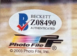 A Beckett authentication sticker with code Z08490 appears above a colorful Photo File logo and © 2003 Photo File, Inc. on the Dwyane Wade Signed Framed 8x10 Miami Heat Photo BAS by Sports Integrity.