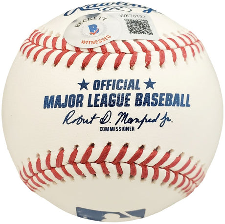 A close-up of a Sports Integrity Walker Buehler Boston Red Sox Signed Official MLB Baseball featuring red stitching, "Official Major League Baseball" text, the commissioner's signature, and a Beckett authentication sticker.