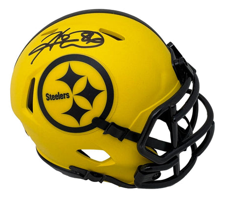 The Sports Integrity Hines Ward Signed Pittsburgh Steelers Rave Mini Speed Replica Helmet BAS features a yellow helmet with a black faceguard, Steelers logo, and Hines Ward’s autograph in black marker.