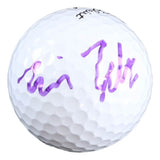 A Will Zalatoris signed PGA Titleist Pro V1 golf ball by Sports Integrity, featuring his purple signature on its white surface.