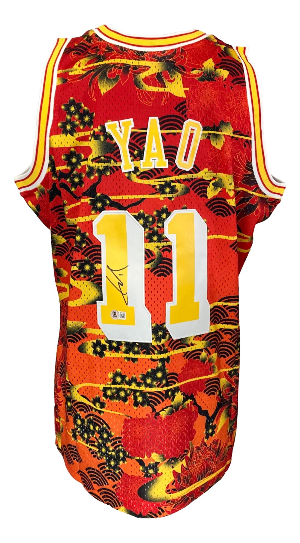 The Sports Integrity Yao Ming Signed Houston Rockets 2004-05 M&N Hardwood Classics Jersey features "Yao" and number 11 in yellow on a vibrant red, orange, and black background, with Yao’s signature visible on the number.