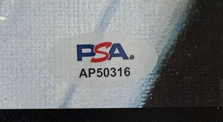 A Sports Integrity Yogi Berra Signed 16x20 Yankees Dvorak 1953 Topps LE/250 Litho features a PSA/DNA sticker with the blue and red PSA logo and serial number AP50316 on a gray and black background.