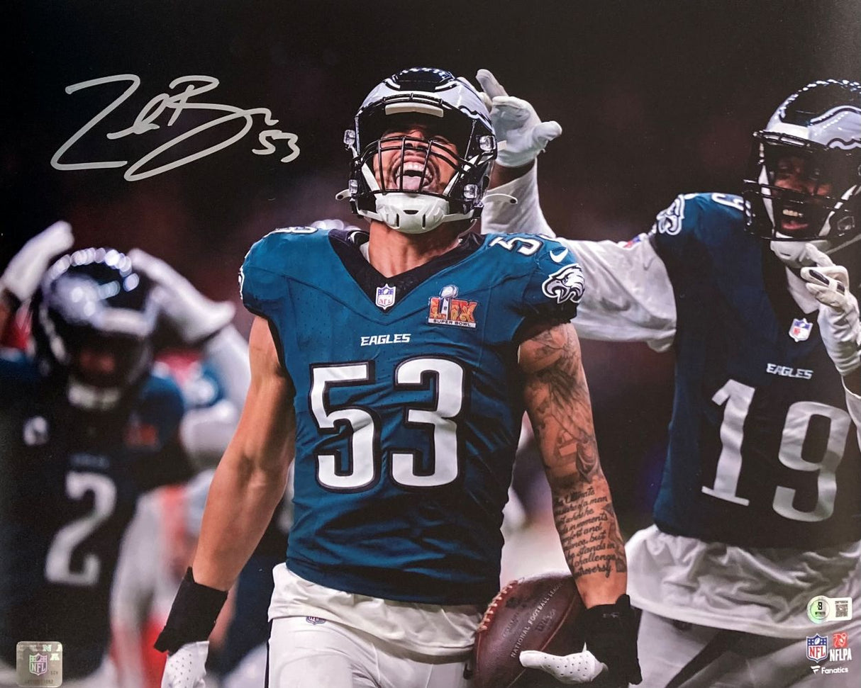 Zack Baun, wearing #53 in a Philadelphia Eagles uniform, celebrates on the field gripping a football with teammates. This 16x20 Super Bowl 59 photo from Sports Integrity is autographed by Baun in the upper left corner.