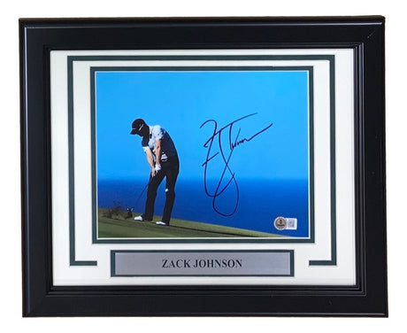 The Sports Integrity Zack Johnson Signed Framed 8x10 PGA Golf Photo features a golfer preparing to putt by the blue ocean, with Johnson's autograph and a name plaque displayed at the bottom.